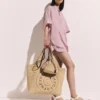 Borsa a secchiello Falabella in rafia lavorata all’uncinetto Borsa a secchiello Falabella in rafia lavorata all’uncinetto