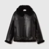 Giacca vegana con cintura in shearling Giacca vegana con cintura in shearling