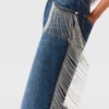 Jeans in denim a gamba dritta con nappine a catena