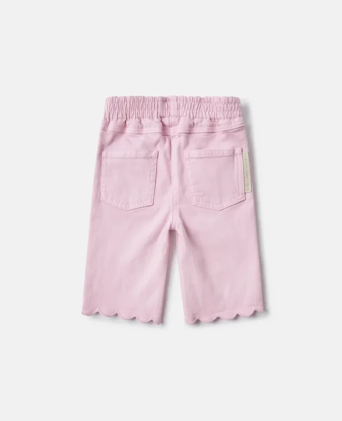 Jeans in denim con bordi smerlati Jeans in denim con bordi smerlati