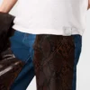Jeans in denim con inserti in pelle di serpente Jeans in denim con inserti in pelle di serpente