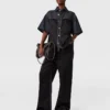 Jeans in denim con pannelli in raso a gamba larga Jeans in denim con pannelli in raso a gamba larga