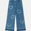 Jeans in denim elasticizzato con toppa a forma di cuore con frange Jeans in denim elasticizzato con toppa a forma di cuore con frange