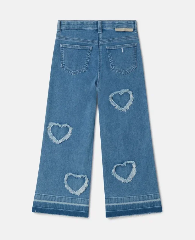 Jeans in denim elasticizzato con toppa a forma di cuore con frange Jeans in denim elasticizzato con toppa a forma di cuore con frange