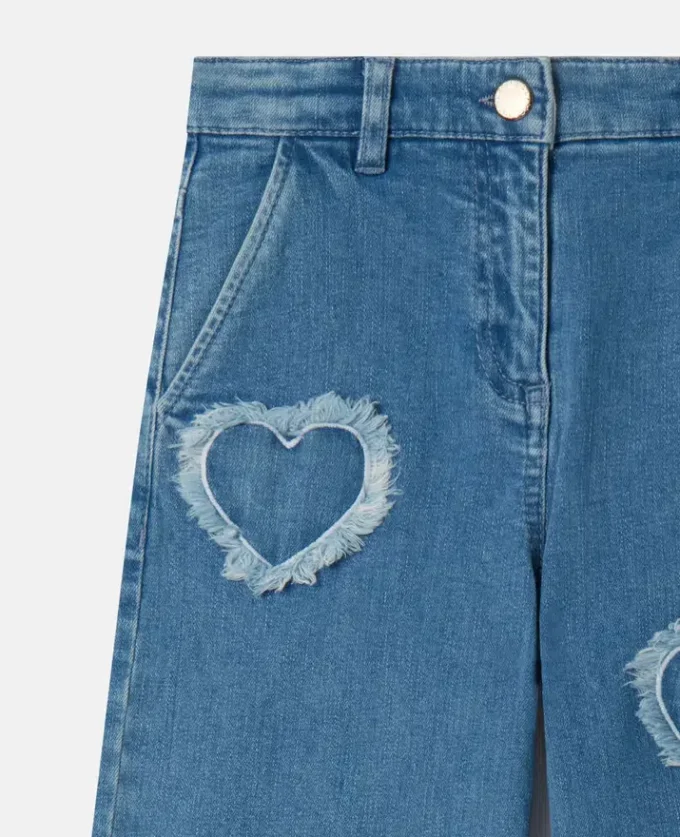 Jeans in denim elasticizzato con toppa a forma di cuore con frange Jeans in denim elasticizzato con toppa a forma di cuore con frange