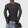 Maglione con spalle scoperte e paillettes Maglione con spalle scoperte e paillettes