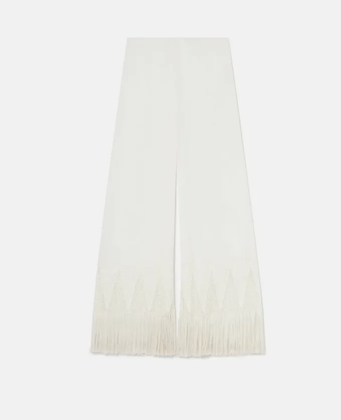 Pantaloni a gamba larga con frange e maglia aperta Pantaloni a gamba larga con frange e maglia aperta