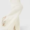Pantaloni a gamba larga con frange e maglia aperta Pantaloni a gamba larga con frange e maglia aperta