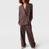 Pantaloni a vita bassa con pieghe Pantaloni a vita bassa con pieghe