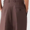 Pantaloni a vita bassa con pieghe Pantaloni a vita bassa con pieghe