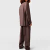 Pantaloni a vita bassa con pieghe Pantaloni a vita bassa con pieghe