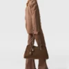Pantaloni a vita media con taglio botcut Pantaloni a vita media con taglio botcut