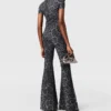 Pantaloni a zampa di media altezza con stampa leopardata Pantaloni a zampa di media altezza con stampa leopardata