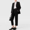 Pantaloni in lana a vita alta con pieghe Pantaloni in lana a vita alta con pieghe