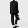 Pantaloni in lana a vita alta con pieghe Pantaloni in lana a vita alta con pieghe