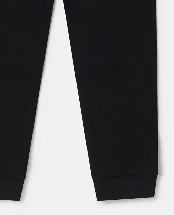 Pantaloni jogging con toppe sui ginocchi Pantaloni jogging con toppe sui ginocchi