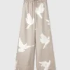 Pantaloni oversize con coulisse e stampa colomba Pantaloni oversize con coulisse e stampa colomba
