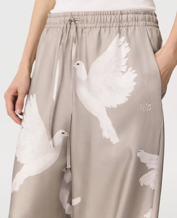 Pantaloni oversize con coulisse e stampa colomba Pantaloni oversize con coulisse e stampa colomba