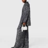 Pantaloni oversize con coulisse e stampa leopardata Pantaloni oversize con coulisse e stampa leopardata