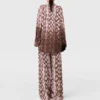 Pantaloni oversize con coulisse e stampa serpente Pantaloni oversize con coulisse e stampa serpente