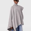Poncho asimmetrico con collo alto in maglia Poncho asimmetrico con collo alto in maglia