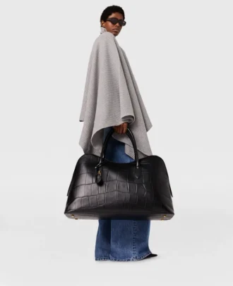 Poncho asimmetrico con collo alto in maglia