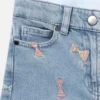 Shorts in denim con stampa a fiocchi a righe Shorts in denim con stampa a fiocchi a righe