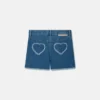 Shorts in denim elasticizzato con toppa a forma di cuore con frange Shorts in denim elasticizzato con toppa a forma di cuore con frange