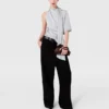 Top asimmetrico con collo annodato Top asimmetrico con collo annodato